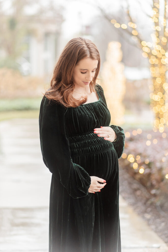 Expectant mother holding her bump during a rainy maternity photoshoot in alpharetta, georgia